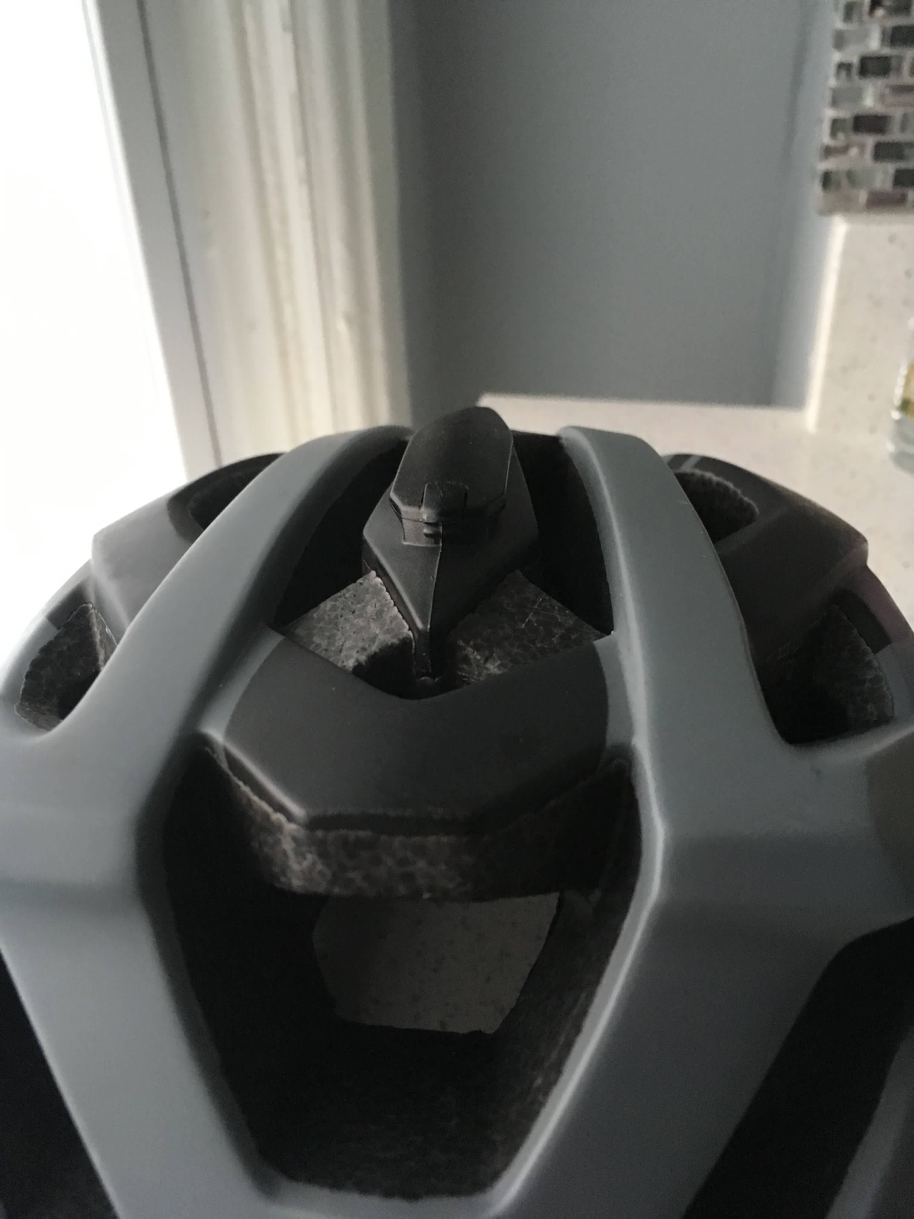 Track with locking notch along top of helmet